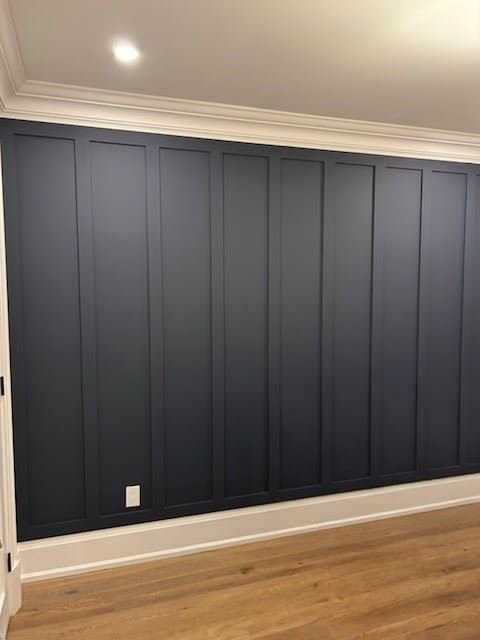 Interior board and batten wall in dark navy with narrow spacing between the battens